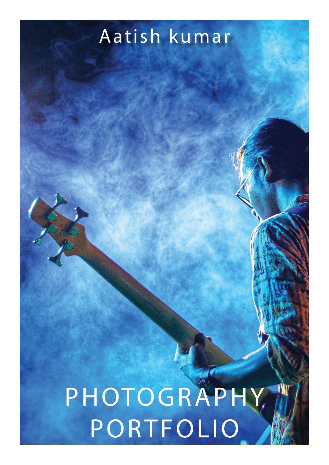 Cover of the Photography Portfolio book — a bass guitarist photographed from below against blue stage smoke, with the author’s name above and the title set in wide white capitals below.