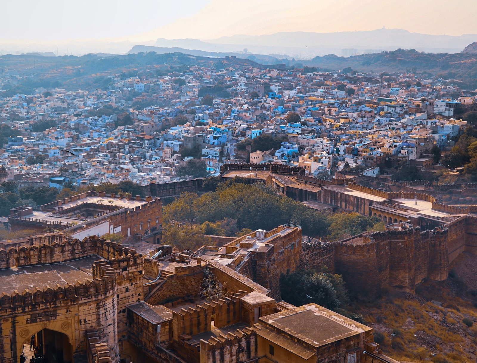 Jodhpur photographed from the fort — indigo-painted houses packed to the horizon, with the ramparts in the foreground.