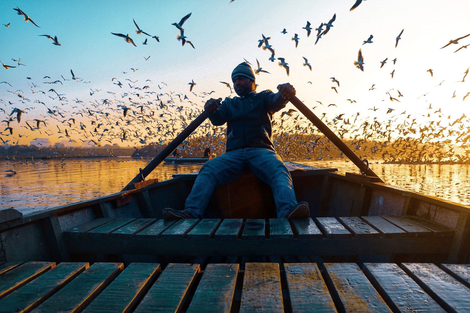 Opening frame of THE RIVER AT DAWN — birds / boats / first light.